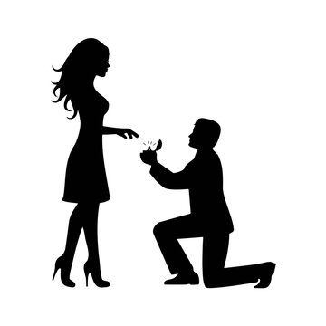 Man proposing marriage to woman with engagement ring silhouette