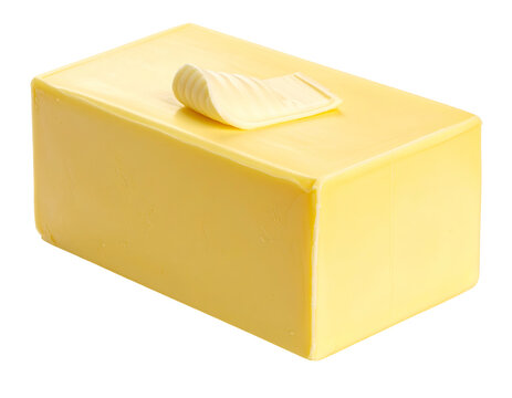Isolated block of yellow butter with a decorative curl on top, fresh dairy product