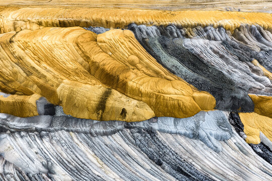 Aerial view of the textured earth and coal layers at the Tagebau Hambach open-pit mine in Elsdorf, Nordrhein-Westfalen, Germany.
