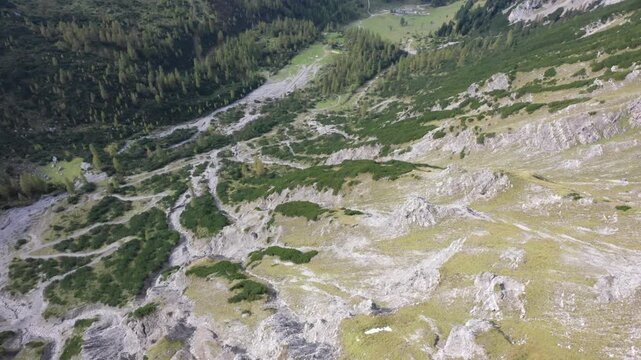 Aerial view of a valley surrounded by mountains with sparse vegetation, Eng, Tyrol, Austria