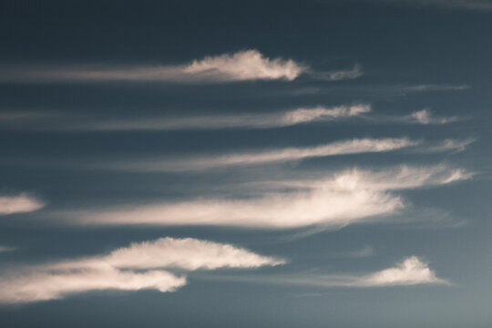 View of elongated clouds drifting across the sky above Vormsi, Laane County, Estonia.