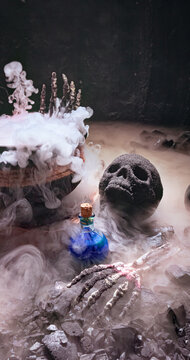 Spooky Halloween scene with a skull and cauldron.