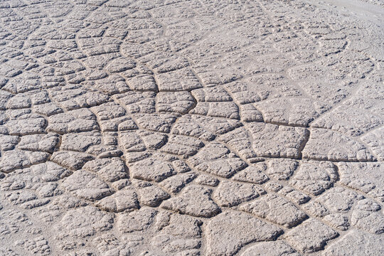 View of the cracked, dry, light-colored earth surface of the Tailings Storage Facility in Padina, Varna, Bulgaria.