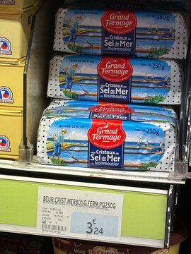 Packages of Grand Fermage semi-salted butter with Noirmoutier sea salt crystals displayed on a retail shelf above a 3.24 euro price label - Rouen, France - September 5, 2026
