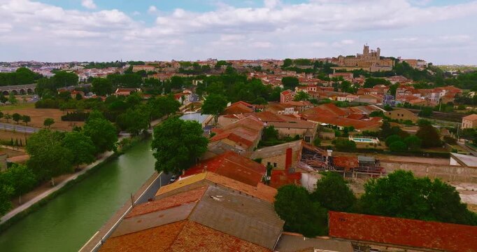 Aerial view of Beziers, charming historic city in southern France, known for the Cathedral of Saint Nazaire, the Canal du Midi, picturesque streets, traditional French architecture