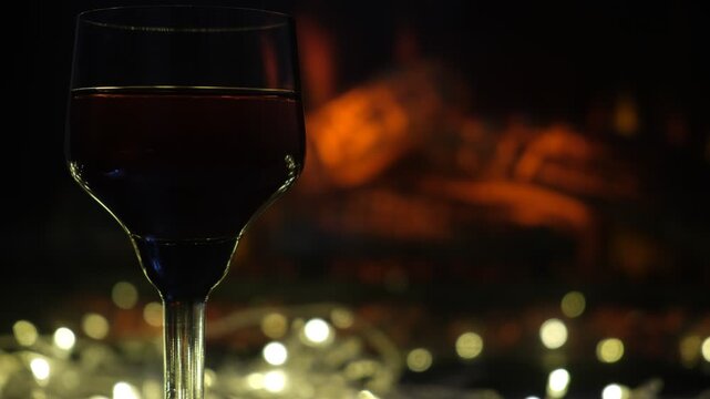Glass of fine brandy. Rich, warm tones of the spirit mirror the fire&rsquo;s glow, creating a scene steeped in coziness and calm. Perfect winter evening&nbsp;&mdash;&nbsp;slow, indulgent, and utterly peaceful.