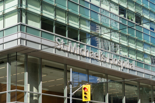 Toronto, Ontario, Canada - October 5, 2026: St. Michael's Hospital exterior signage on the building  in downtown Toronto, Ontario, Canada. St. Michael's Hospital is a teaching hospital and medical cen