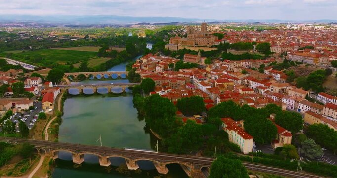 Aerial view of Beziers, charming historic city in southern France, known for the Cathedral of Saint Nazaire, the Canal du Midi, picturesque streets, traditional French architecture