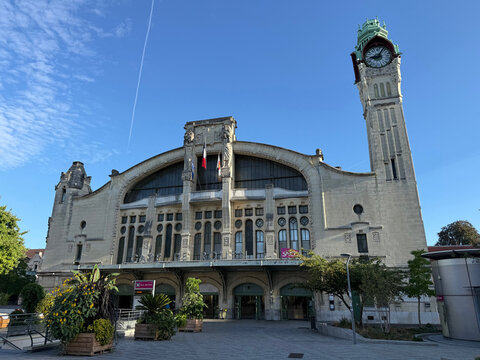Facade and clock tower of Rouen railway station, with planted containers - Rouen, France - September 6, 2026