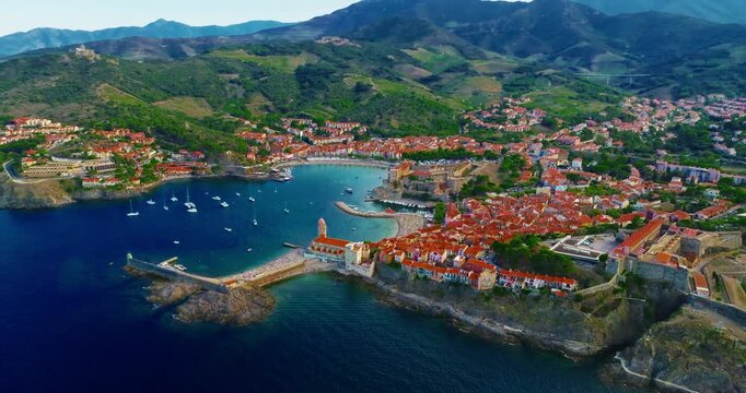Aerial view of the beautiful, picturesque village of Collioure on the Mediterranean coast, featuring the lovely Fort Saint Elme by the sea, France, near the city of Perpignan.