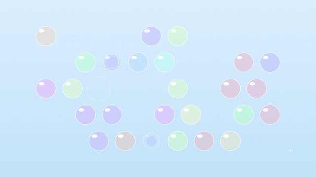 Colorful soap bubbles popping on light blue gradient background creating dynamic motion for whimsical footage