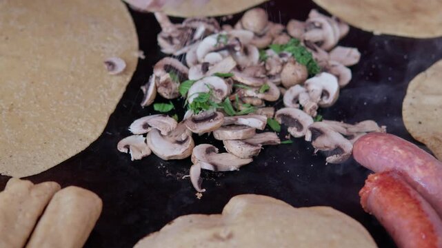 Mexican street food cooking on a comal