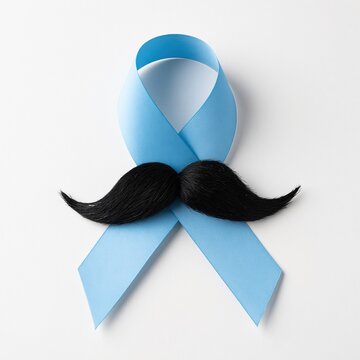 Ribbon with a mustache symbol for movember prostate cancer awareness and men health charity support