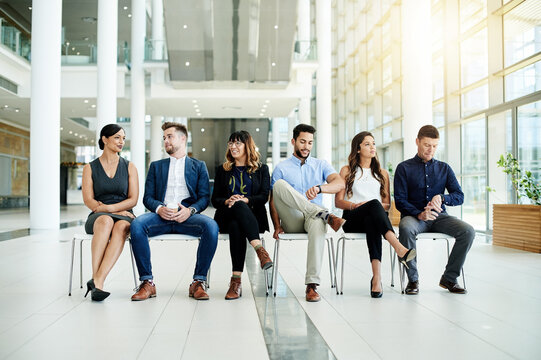 Job interview, waiting or people in lobby for appointment, hiring or human resources in office. Group, hire or applicants in line for recruitment process, employment search or application opportunity