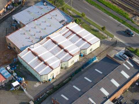 Melbourne, VIC, Australia - 05 October 2026: Aerial view of the industrial factories and substation in Boronia and Bayswater with metal rooftops, adjacent roads, and railway tracks.