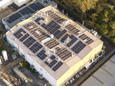 Melbourne, VIC, Australia - 05 October 2026: Aerial view of the factory roof covered in solar panels in the Boronia and Bayswater industrial area.