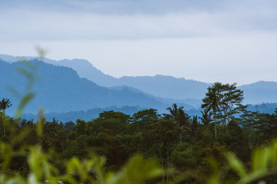 A view of the mountains in the morning, with layers of mist visible.