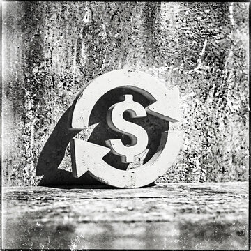 Vintage black and white dollar sign symbol with recycling arrows on a gritty concrete background representing circular economy