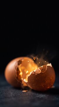 Golden light spilling from cracked eggshell