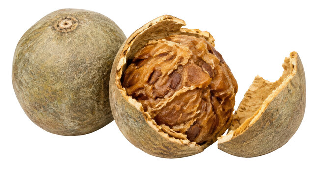 Close-up of whole and cracked open Bael fruit, revealing its fibrous pulp and seeds on a white background.