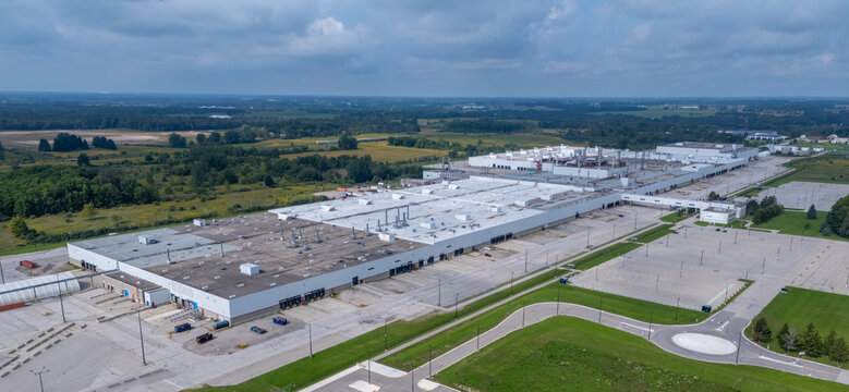 Ingersoll, Ontario, Canada - 13 September 2026: Aerial view of the GM CAMI Assembly plant, a large industrial facility with white rooftops, loading docks, and parking lots.