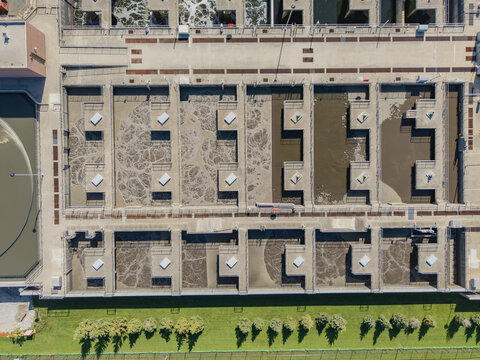 Green Bay, WI, United States - 22 September 2026: Aerial view of the Green Bay Metropolitan Sewerage District, featuring aeration tanks and concrete walkways.