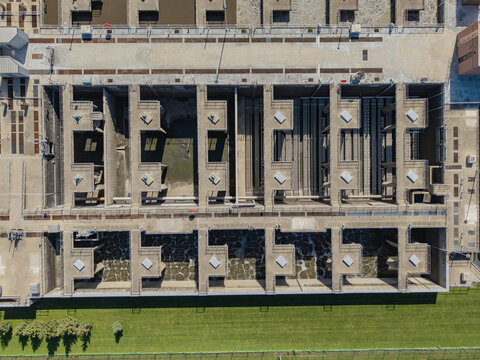 Green Bay, United States - 22 September 2026: Aerial view of the Green Bay Metropolitan Sewerage District facility with concrete aeration tanks, water treatment infrastructure, and grass.