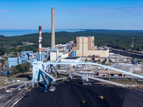 West Olive, Michigan, United States - 28 September 2026: Aerial view of the Consumers Energy J.H. Campbell Generating Complex with industrial buildings, smokestacks, and coal piles.