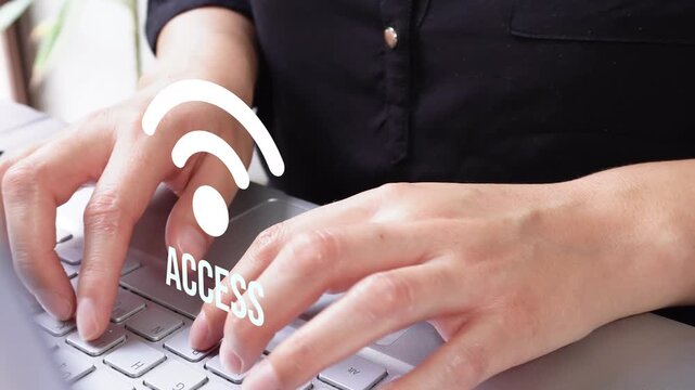 Person types on laptop with wireless access graphic
