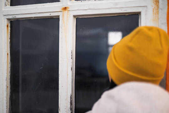 Female traveler at an orange Lighthouse, Iceland
