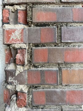 broken red brick wall