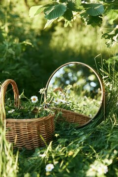 Mirror and baskets in a garden with flowers