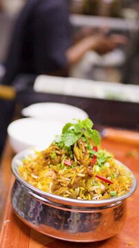 Fresh Steaming Biryani Rice Dish Served in Restaurant Kitchen