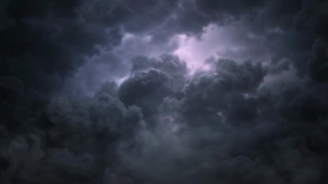 Lightning Flashes in Dark Storm Clouds at Night