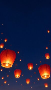 Floating sky lanterns glowing in dark night sky during traditional lantern festival celebration background