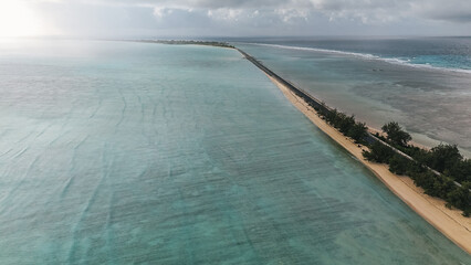 Narrow strip of land that forms a highway to the next atoll. © gshakwon