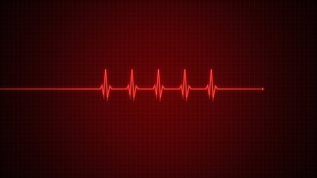Red heart rate monitor display showing rhythmic pulse line on dark