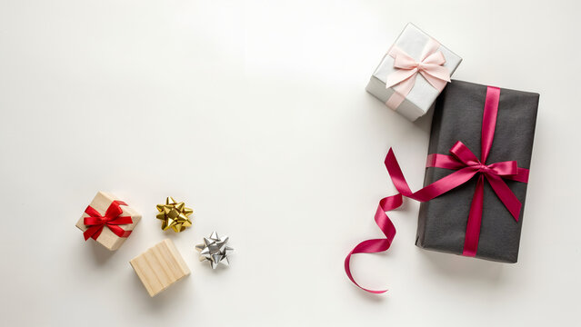 Top view of various gift boxes and decorative bows isolated on white background