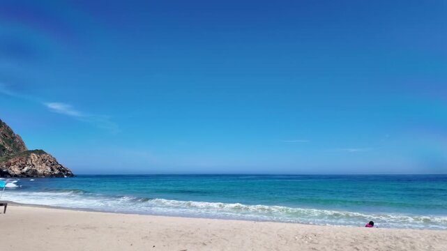 Tropical beach and calm sea under bright sun, Venezuela