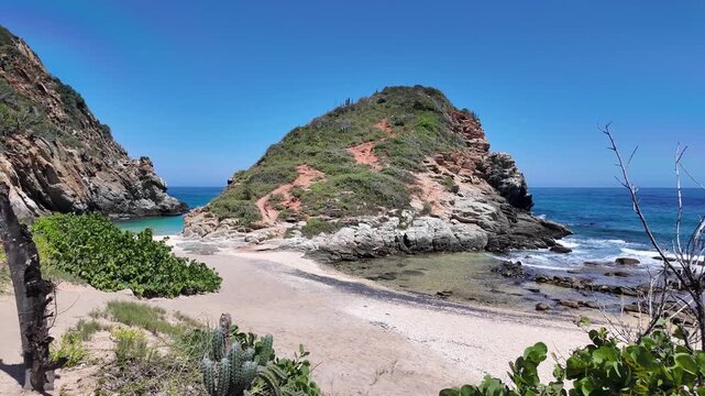 Rugged cliffs surrounding a Caribbean cove in Venezuela