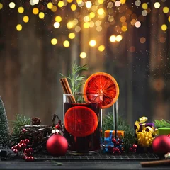 Hot Mulled Wine with Orange Slice and Cinnamon in Festive Christmas Setting © Jenny Sturm