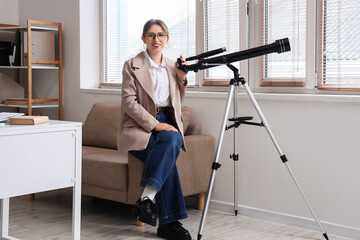 Fototapeta premium Scientific discovery and research, young woman with telescope in office for astronomy education and space exploration study