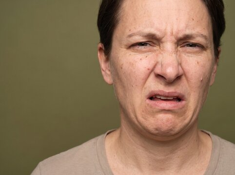 Woman with a disgusted and repulsed facial expression
