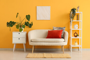 Interior design and home comfort, modern living room with cozy sofa and yellow wall for lifestyle and real estate marketing and home decor projects © Pixel-Shot