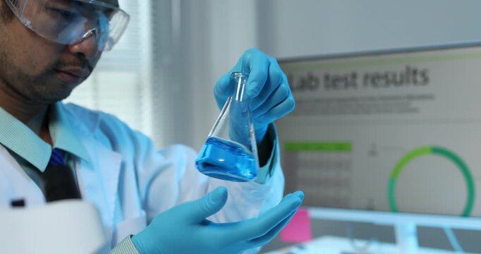 Scientific research and laboratory analysis concept featuring a researcher examining samples, performing experiments and studying test results with modern laboratory equipment.
