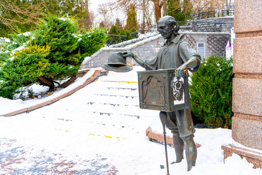 Sorting Hat near Kyiv Theater Dolls, Bronze Monument to Barrel Organ Player in Winter. Kyiv, Ukraine - January 2, 2026