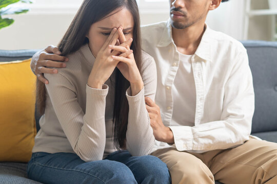 Mental health monitoring and therapy concept. Boyfriend consoling his anxious girlfriend and comforts give her mental support.