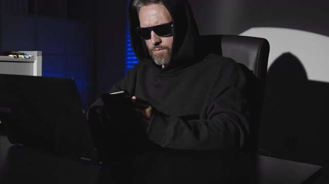 Hacker operates in secrecy. Online danger rises when a Hacker exploits weaknesses. IT breach spreads after a Hacker infiltrates servers. Digital theft occurs when a Hacker steals money.