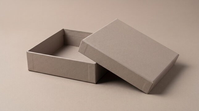 Empty cardboard gift box mockup with lid on beige background