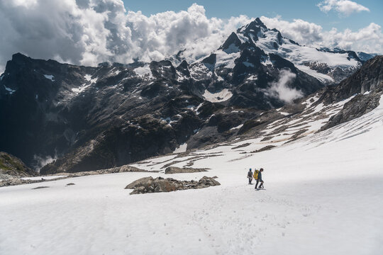 Two Mountaineers Walking on Snowy Glacier in Tantalus Range, Squamish